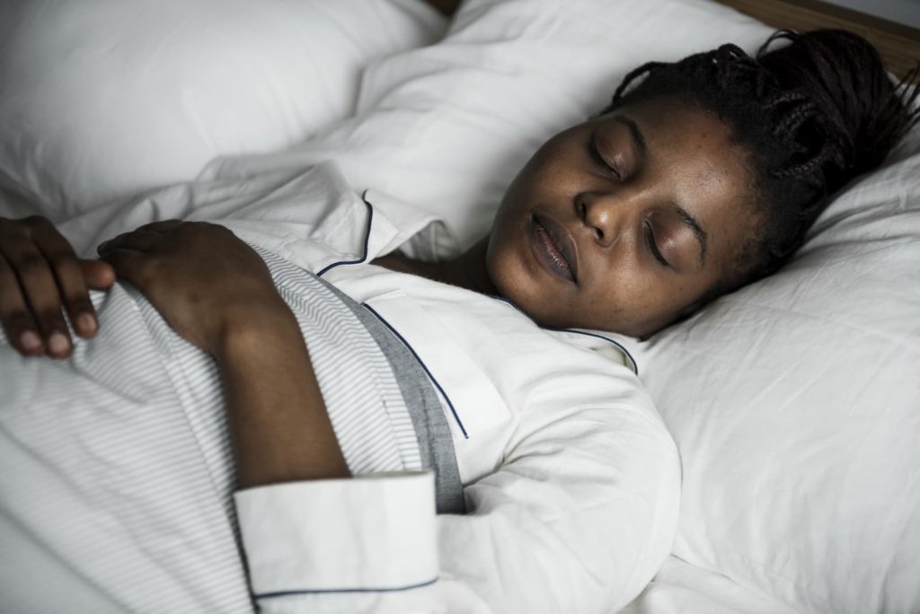 Woman lying in a bed, sleeping