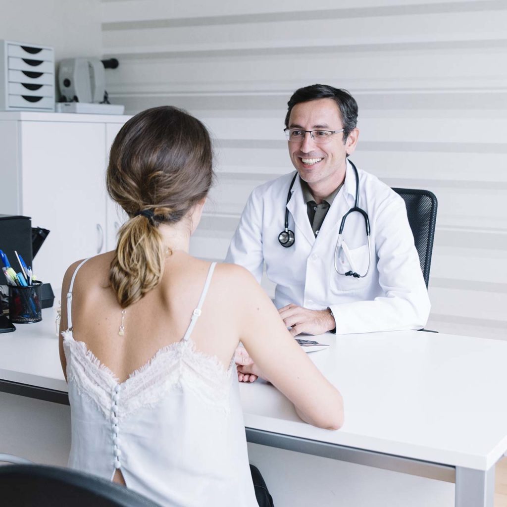 Male doctor with female patient